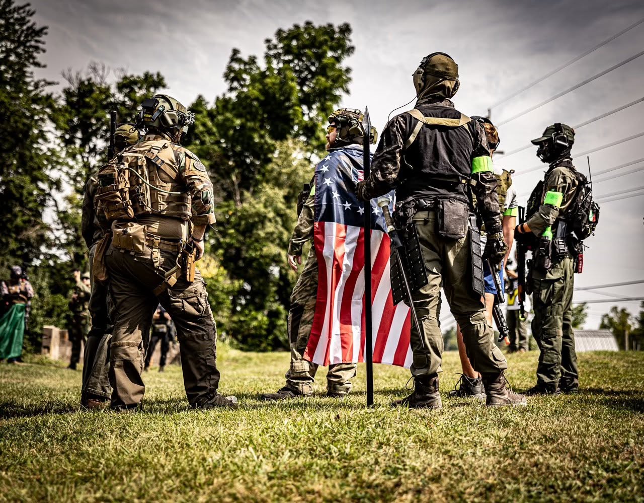 Players with American flag at a field event